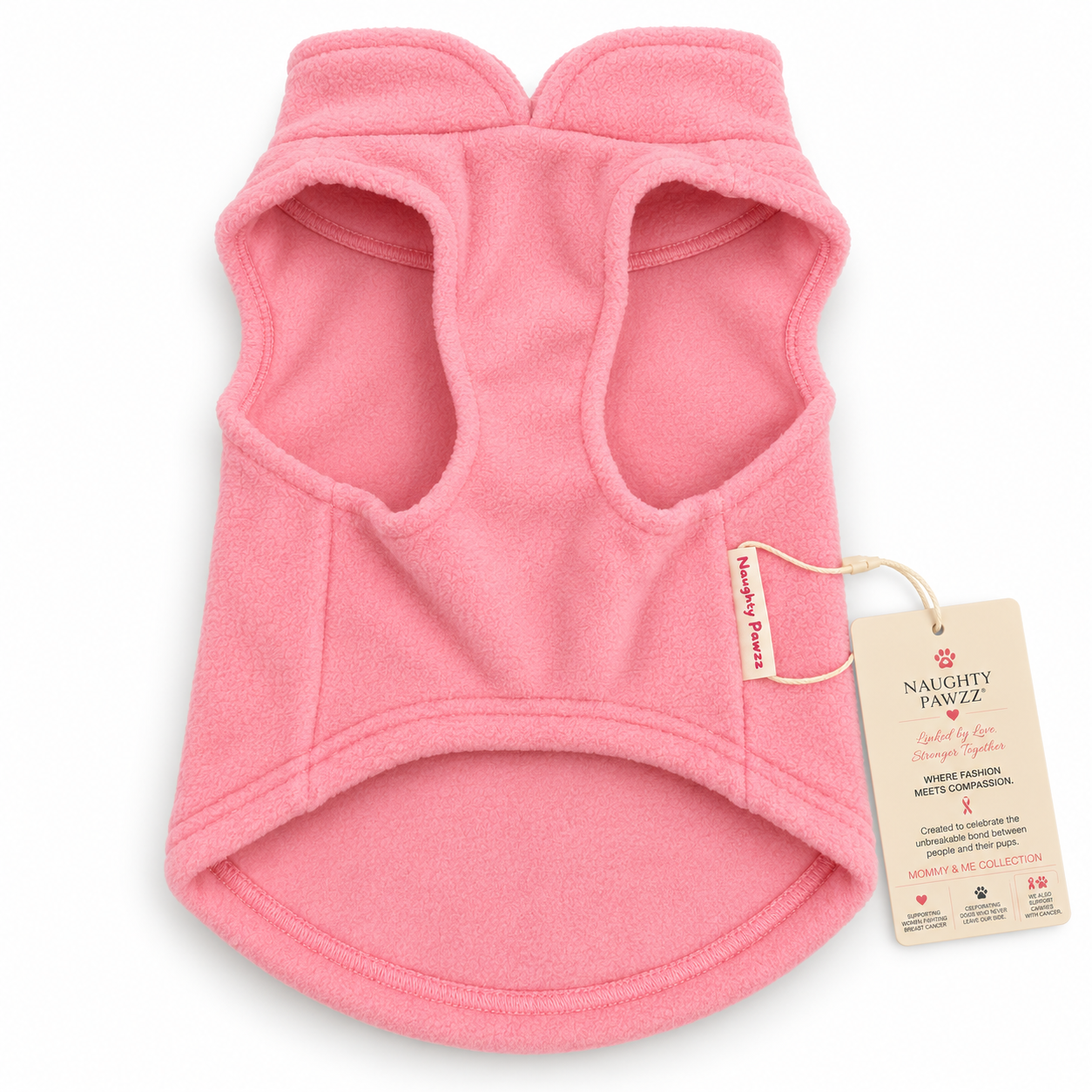 A soft pink fleece pet sweater from the back side of the fleece with an embroidered design featuring a gold and red paw print with a red ribbon and the word 'Cancer' in red script. Detailed with Naughty Pawzz logo and hang tags.
