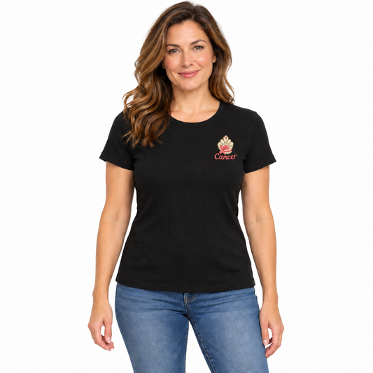 A woman modeling a black short-sleeve crewneck t-shirt with a small red and gold Cancer zodiac sign graphic on the left chest, paired with blue jeans against a plain white background.